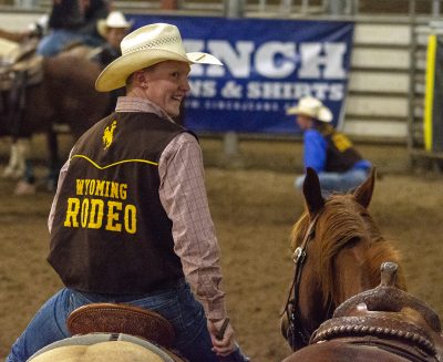 A rodeo team member is in saddle atop a horse