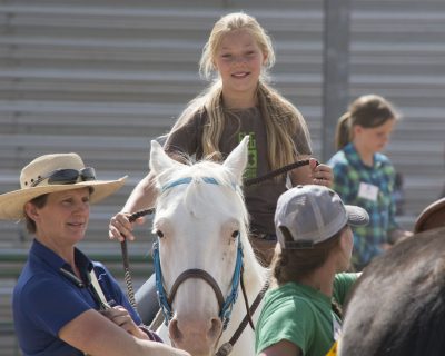 4-H'er is riding a horse