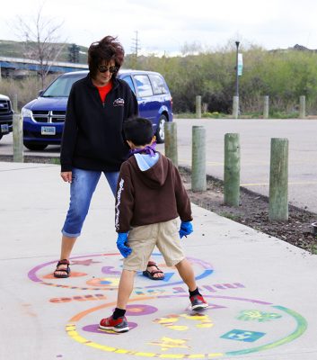 Marilee Jackson and her grandson on the Mirror Me stencil.