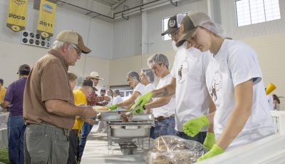 Line of people serving food