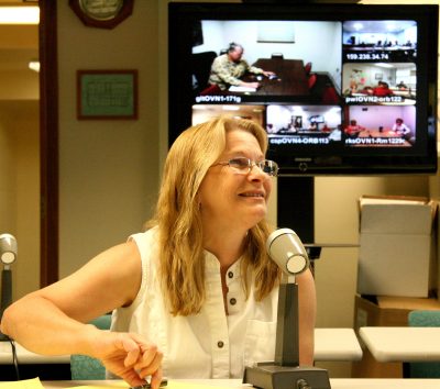 Photograph of woman at desk