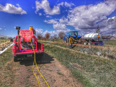 Crew burning irrigation ditch