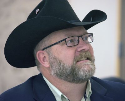 Photograph of man in cowboy hat