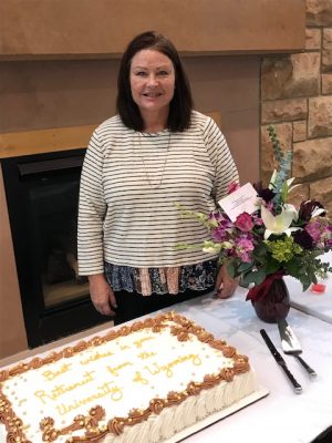 Photo of woman by cake