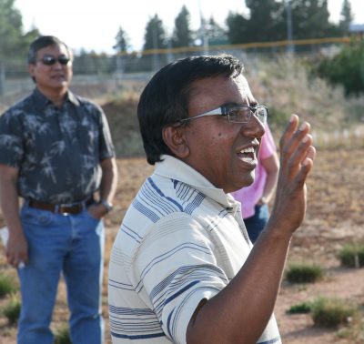 Man speaking in field