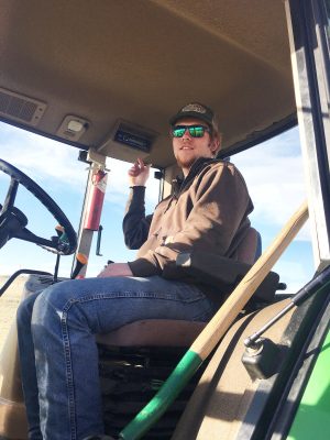 Student in a tractor