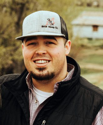 Man in vest and hat