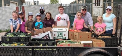 Photograph of group behind food on trailer