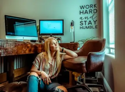 Girl sitting at desk looking up