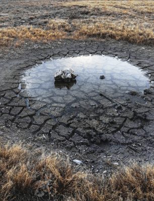 Image of evaporating pond and dried mud