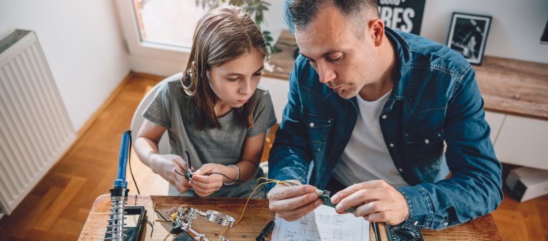 Father and daughter working on STEM project.