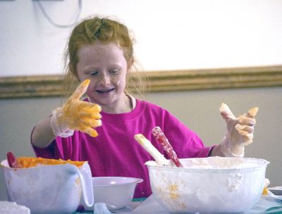 Photograph of young girl and cake