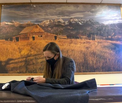 Individual examining wool product