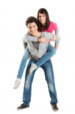 girl getting piggy-back ride from boy