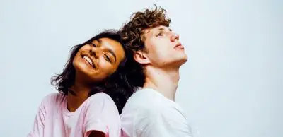 couple sitting back to back