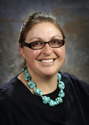 Girl in glasses smiling