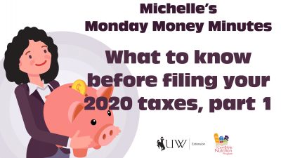 Michelle holding an oversized piggy bank.