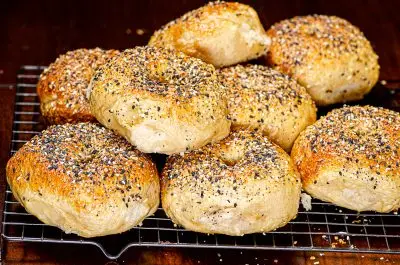 Bagels topped with sesame seeds, poppy seeds, minced garlic, and minced onion.