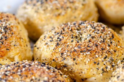 Bagels topped with sesame seeds, poppy seeds, minced garlic, and minced onion.