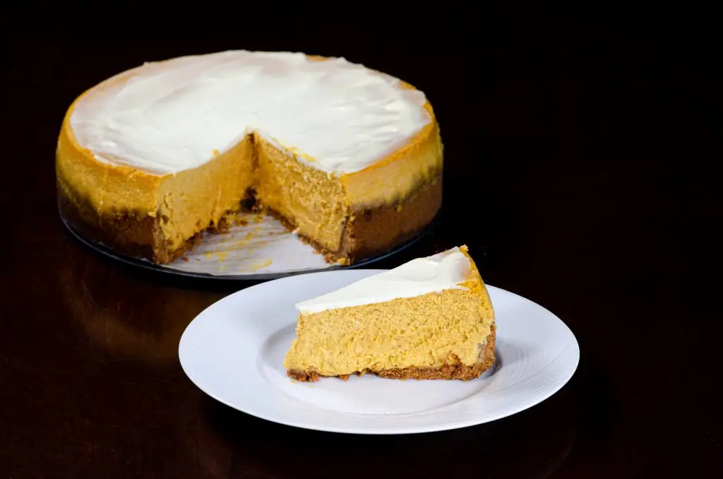 Pumpkin cheesecake on white plate