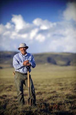 Man standing with shovel