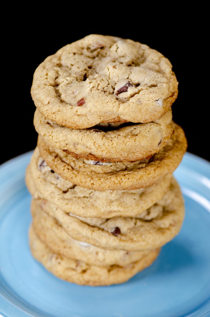 Stack of chocolate chip cookies on a blue plate