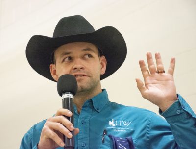 Chance Marshall in black cowboy hat and blue shirt presents at the 2021 Farm & Ranch Days,