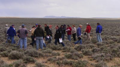 Group of people exploring Wyoming rangeland.