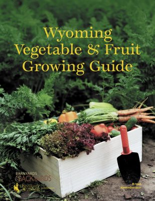 cover of the Wyoming Vegetable and Fruit Growing Guide with photo of white box of vegetables including peppers, carrots and greens