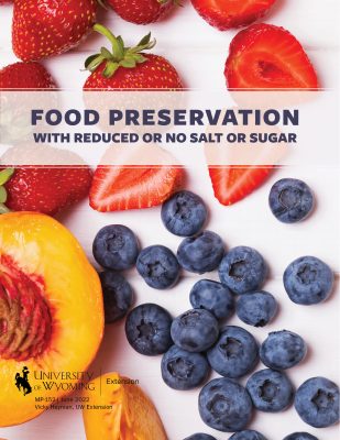 Cover of food preservation recipe collection with strawberries, blueberries, and sliced peach on a white background