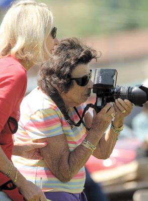 blond woman and older woman with dark hair taking photographs