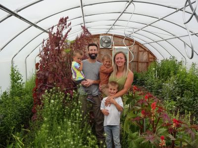 The Seitz family in their greenhouse
