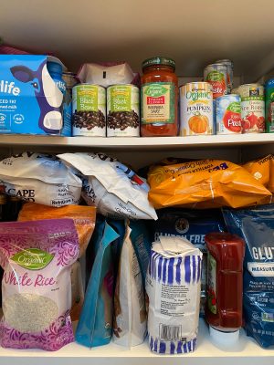 cans, jars, dried foods on shelves