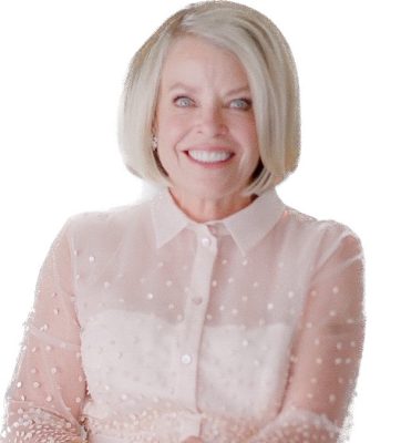 smiling woman with short blonde hair wearing white collared dress