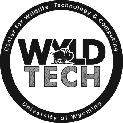 A logo of WYLDTECH in black and white. A circle encompasses the words "Wyld Tech", which also contain a stylized bison. On the circle, the words "Center for Wildlife, Technology and Computing - University of Wyoming" are written.