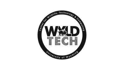 A logo of WYLDTECH in black and white. A circle encompasses the words "Wyld Tech", which also contain a stylized bison. On the circle, the words "Center for Wildlife, Technology and Computing - University of Wyoming" are written.