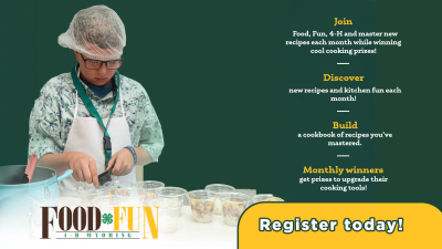 A 4-H participant wearing a hairnet and apron carefully prepares ingredients in small clear cups at a table. The graphic promotes 'Food, Fun, 4-H Wyoming,' encouraging participants to join and master new recipes, discover kitchen fun, build a cookbook, and win monthly cooking prizes. The text includes a call to action to 'Register today!' against a green background.