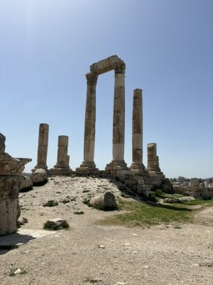 A ruin: several broken columns and one standing arch. 