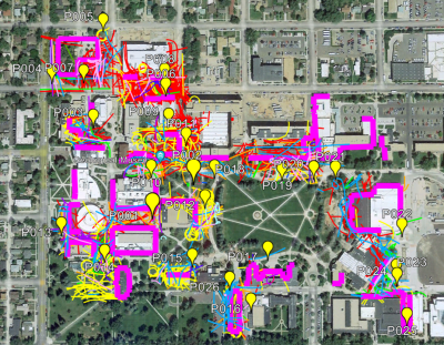 aerial view of the University of Wyoming's Laramie campus overlaid with yellow location markers and colorful lines indicating the movement of different types of bird species and the facades that were monitored in the study