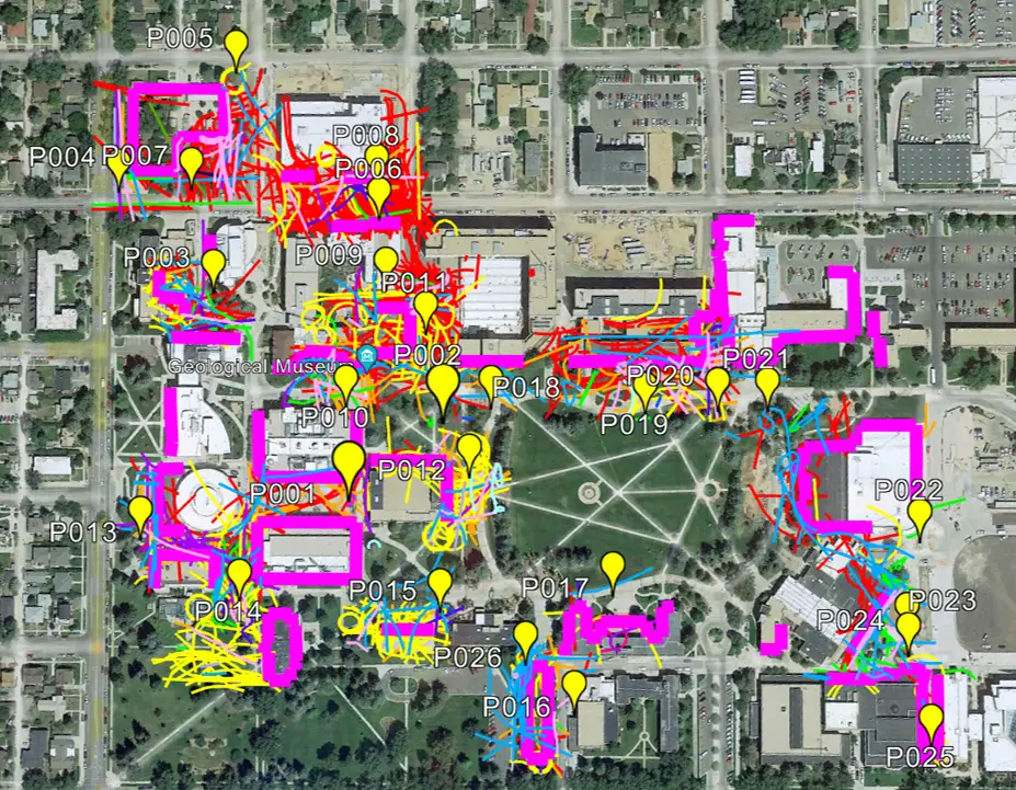 aerial view of the University of Wyoming's Laramie campus overlaid with yellow location markers and colorful lines indicating the movement of different types of bird species and the facades that were monitored in the study