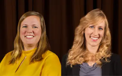 On the left, a woman with shoulder length straight blonde hair wearing a yellow blouse. On the right, a woman with wavy shoulder length blonde hair wearing a gray shirt and black jacket.