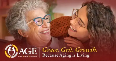 A younger woman and an older woman smiling at each other.