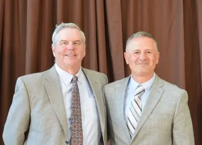 Two men in formal clothing. 