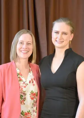 Two women in formal clothing