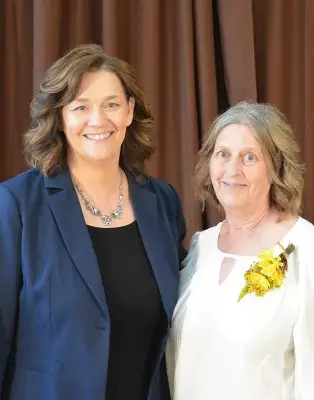 Two women in formal clothing