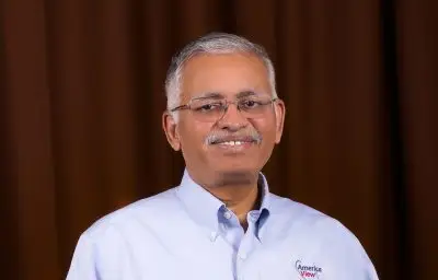 A man holding a plaque that reads "Ramesh Sivanpillai Americaview Lifetime Achievement Award - In Recognition of Outstanding Service to the Remote Sensing Community, the Americaview network, and WyomingView."
