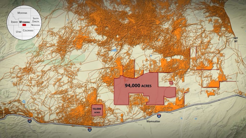 A map covered in orange squiggles with two light red areas.