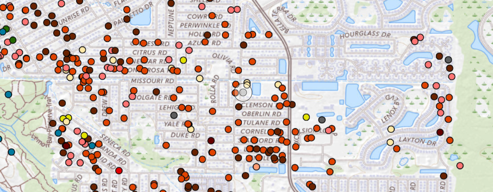 map showing colorful dots, mostly red, yellow, and brownish-red, showing points of damage on streets and residential properties