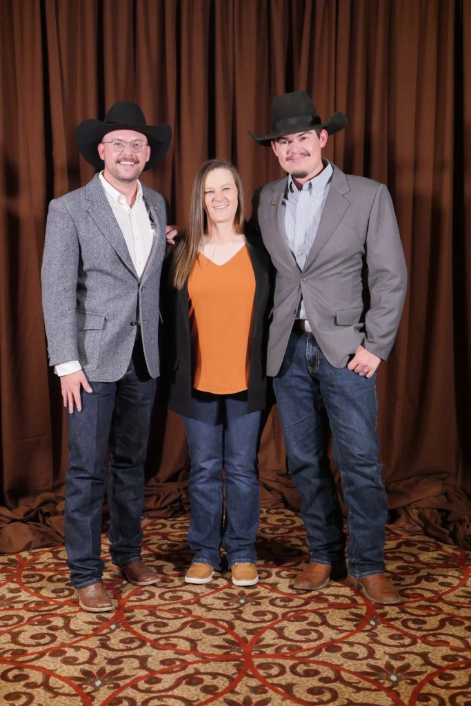 Three people in formal clothing.