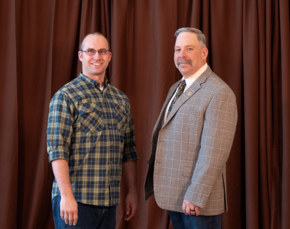 Jeremy Cain, left, and CALSNR Farm Credit Services of America Dean Kelly Crane, right.